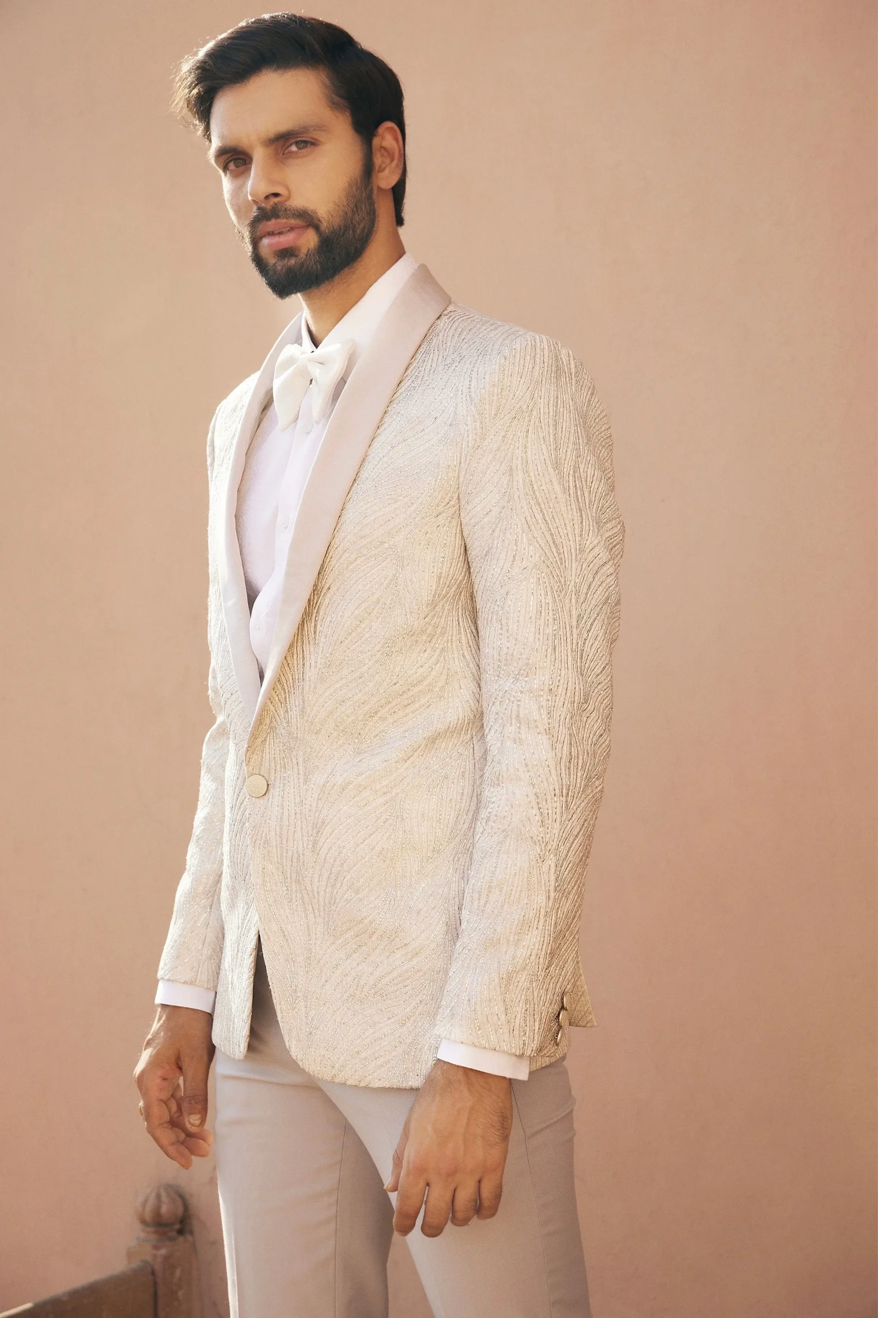 Neil Nitin Mukesh in Pristine Whiteness Tuxedo Set
