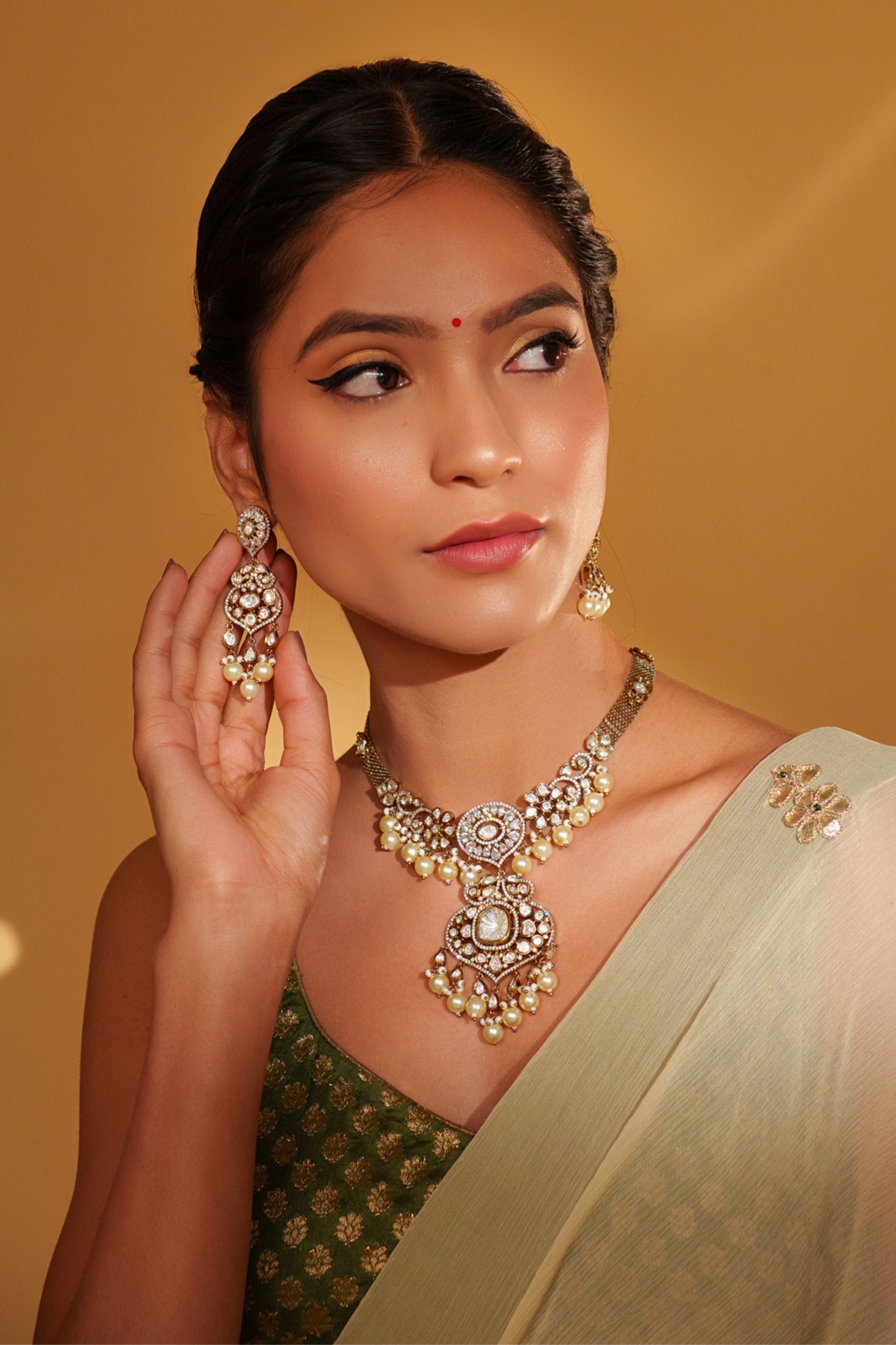 Emanel Bold And Dramatic Two Tone Finish Polki Necklace Set
