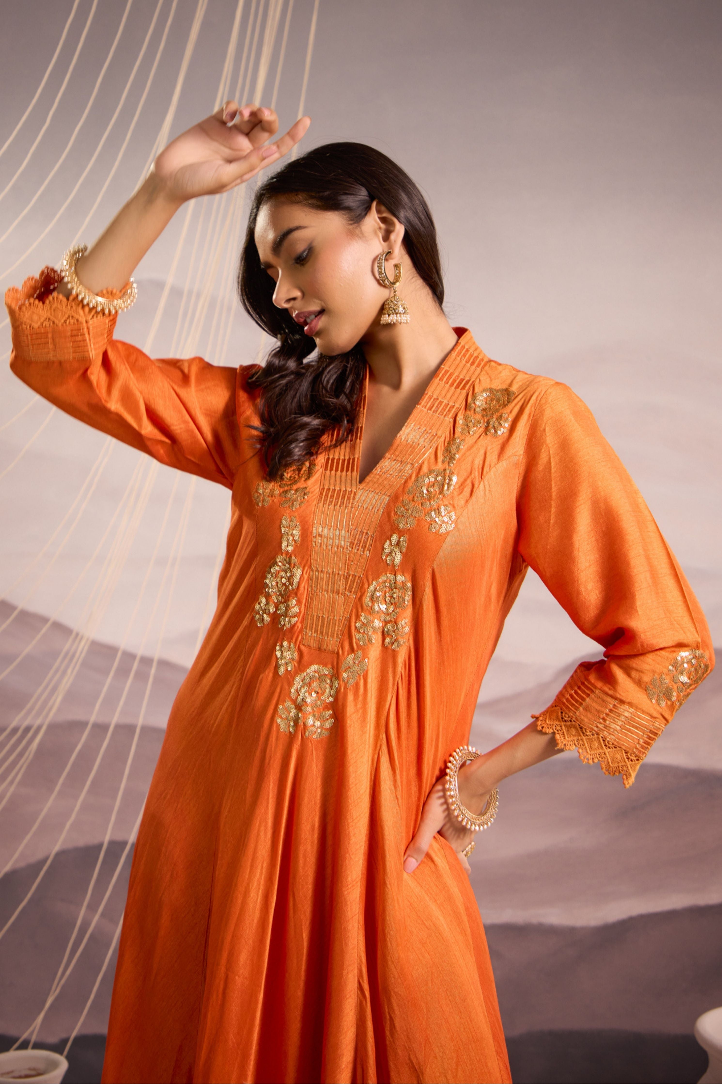 Orange sequin embroidered flared panelled kurta