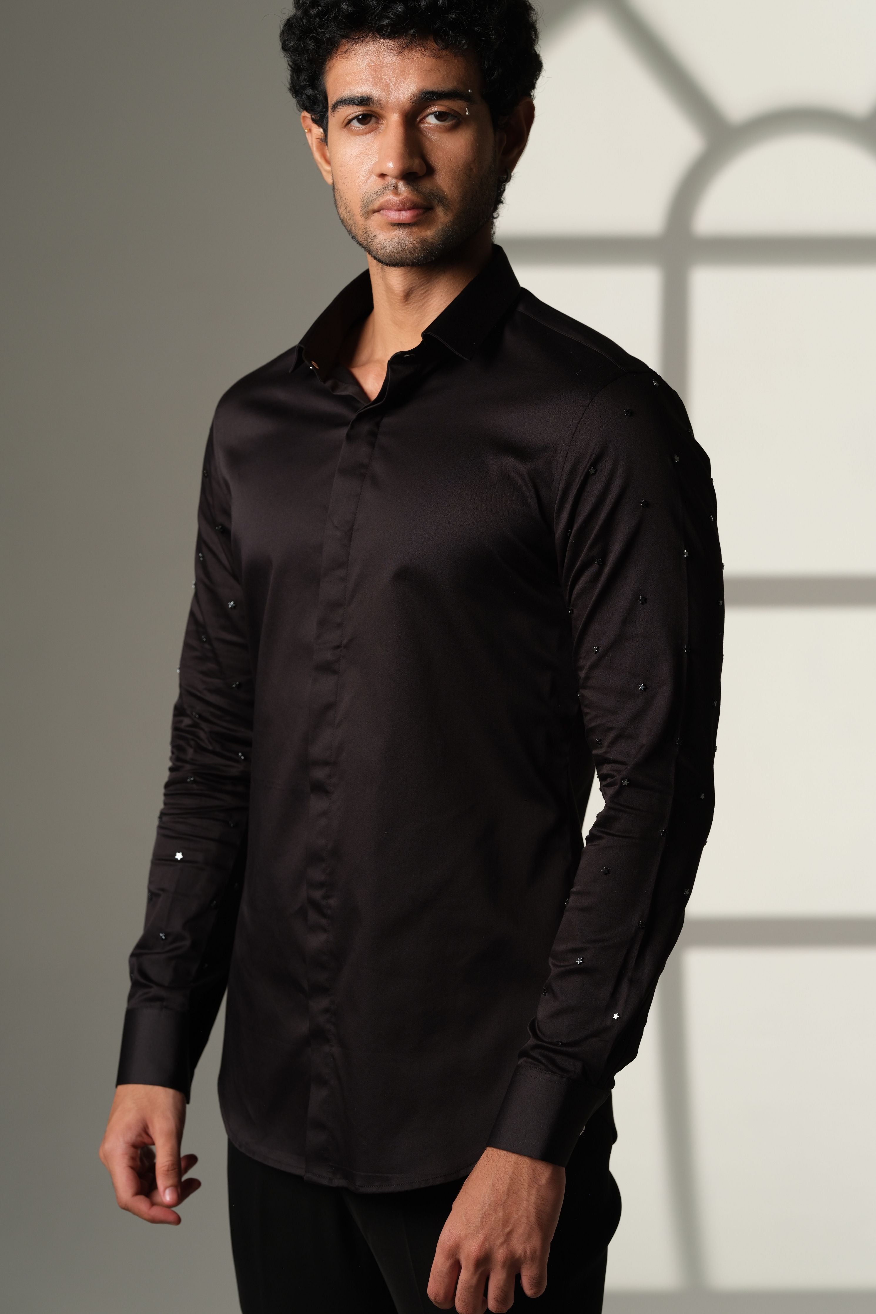 Black Shirt With Artisanal Star Embellishment On Both Sleeves