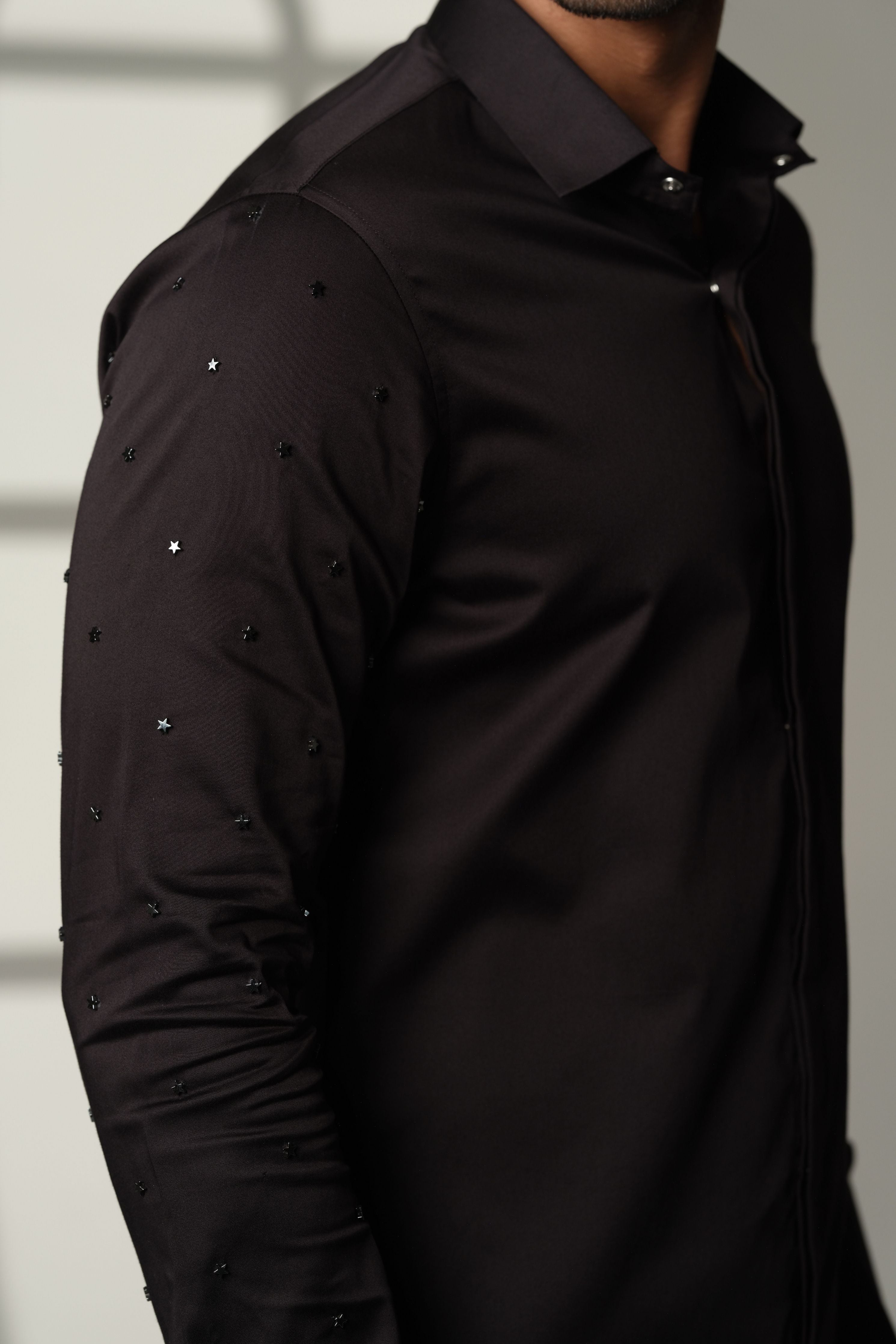 Black Shirt With Artisanal Star Embellishment On Both Sleeves
