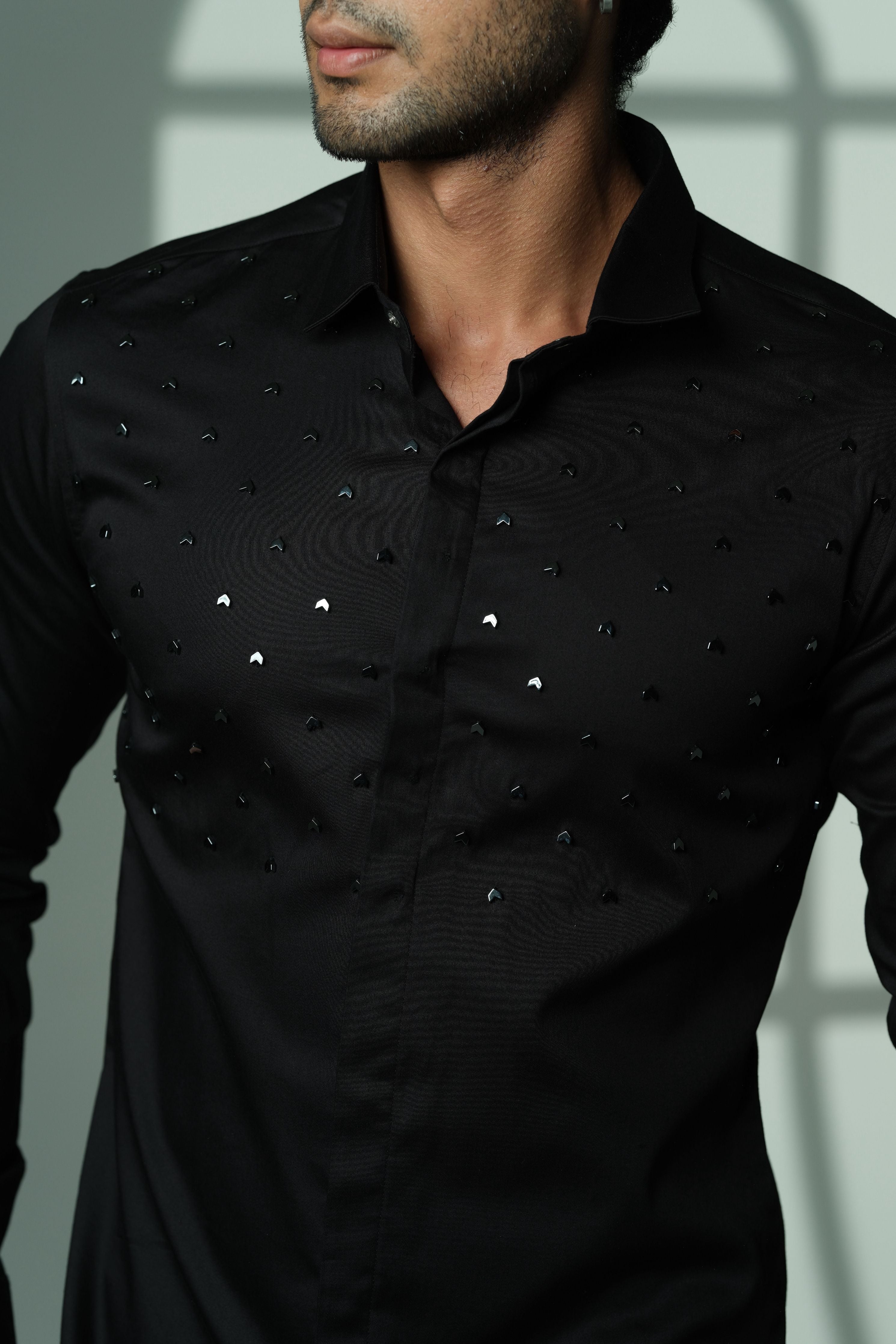 Black Shirt With Arrows Embellishment On half Of The Shirt